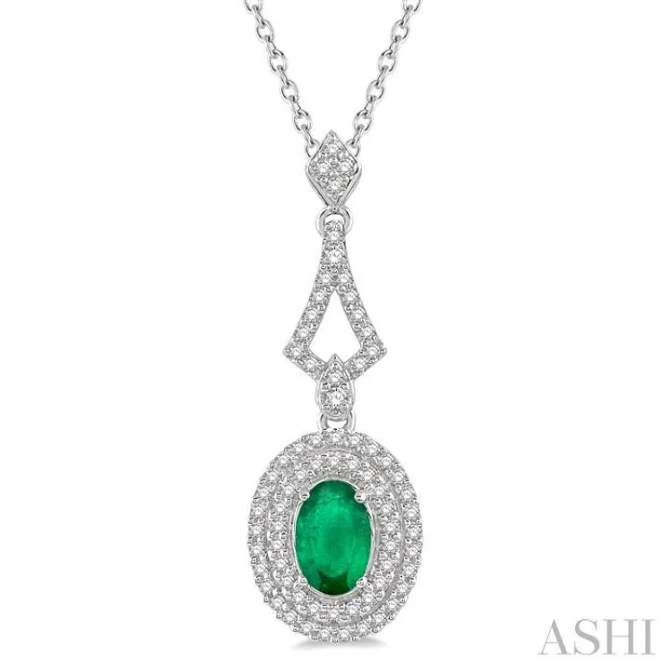 1/5 Ctw Oval Shape 6x4mm Emerald & Round Cut Diamond Precious Pendant in 14K White Gold