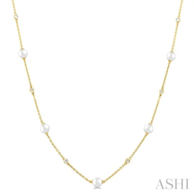 1/8 Ctw 3 MM Cultured Pearl and Round Cut Diamond Station Necklace in 14K Yellow Gold